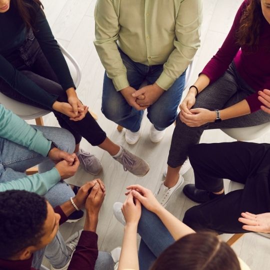 WI Group small Group of people sat in chairs